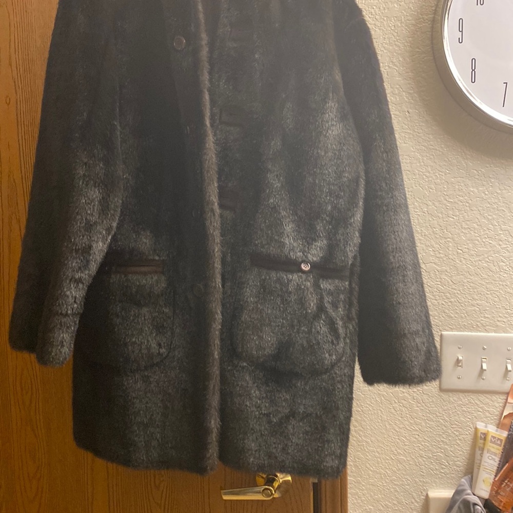 Quarter Length faux Mink it’s suede on the other side very nice Coat with hood.